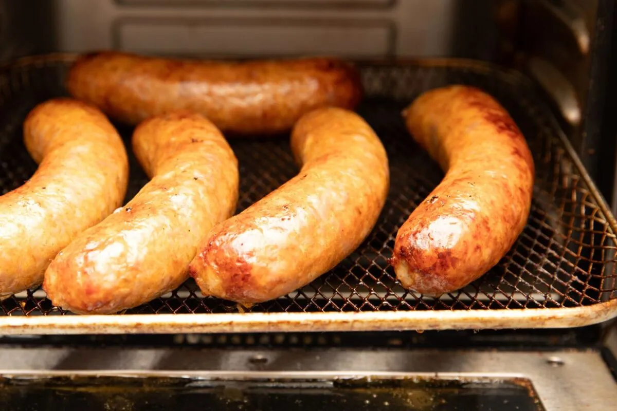 Close up photo of cooking Italian Sausage links.