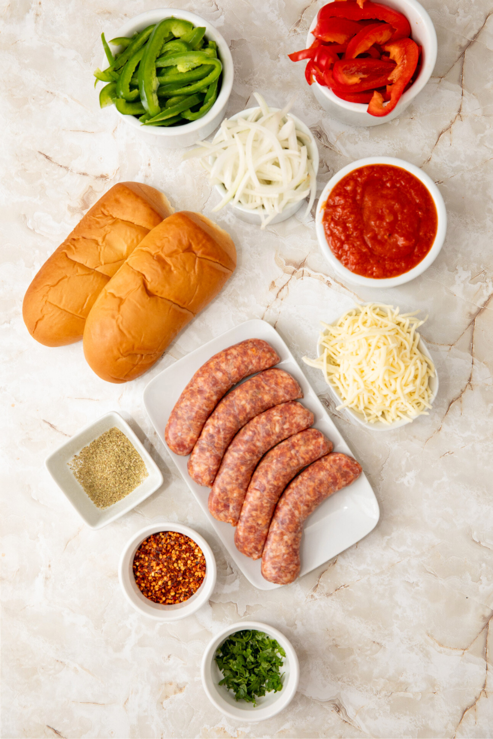 air-fryer-italian-subs-ingredients Ingredients for Air Fryer Italian Subs measured out in white dishes.