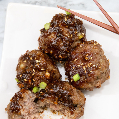 Asian Meatballs on white plate.