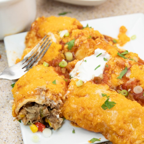 Pulled pork enchiladas made with leftover pulled pork.