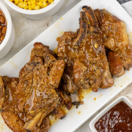 Slow Cooker country style ribs on a white plate.