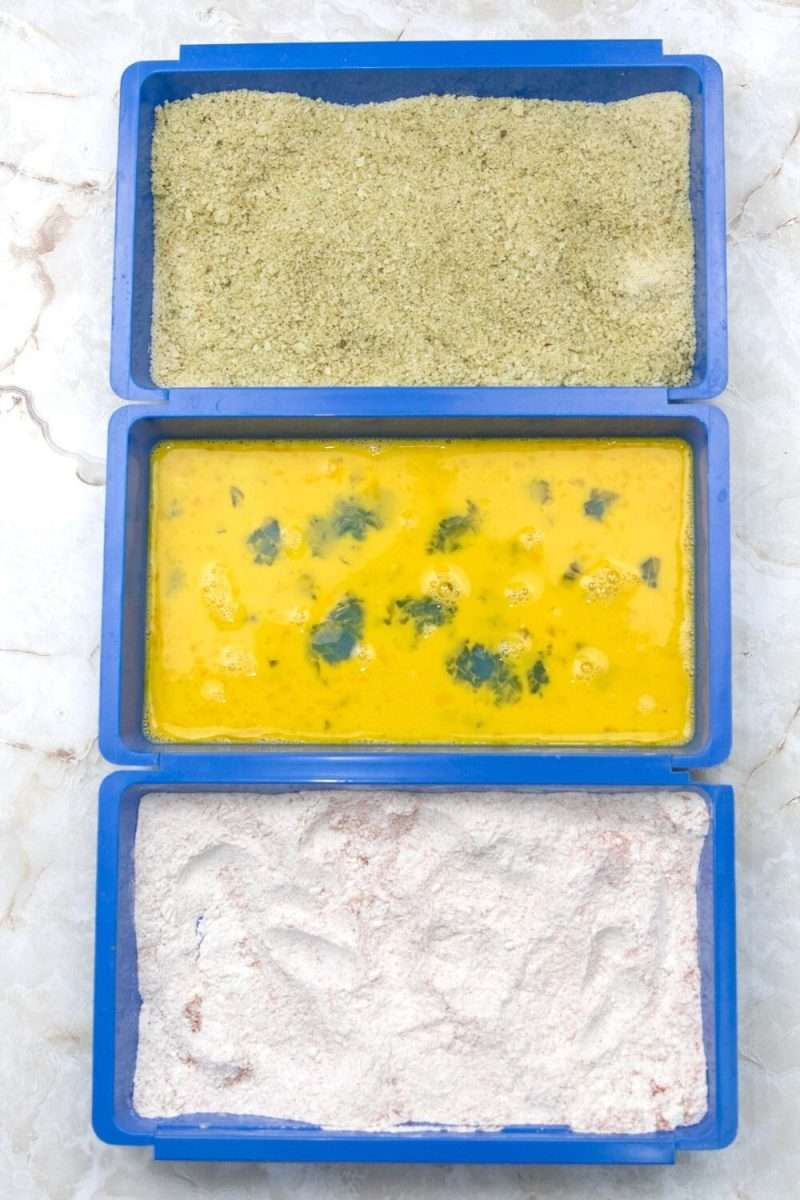 Three compartment tray for dredging of pork cutlets.