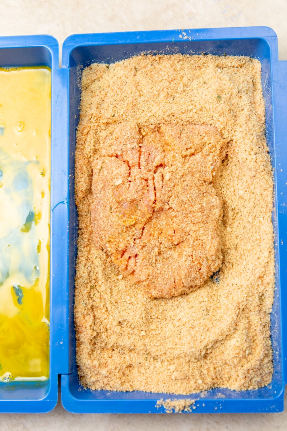 Italian breadcrumbs gently pressed on pork cube steak. 