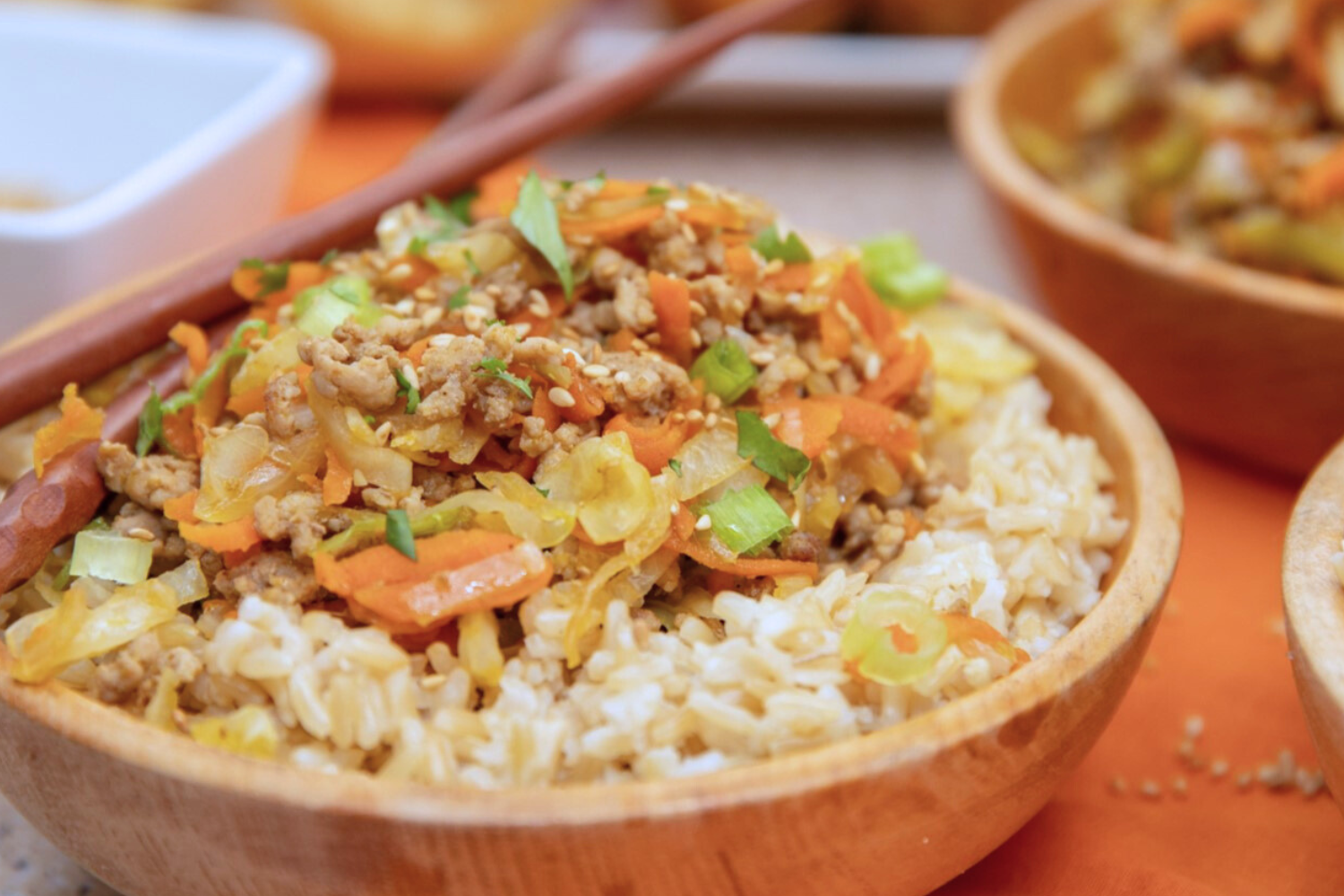 pork-roll-bowl-rice Pork egg roll in a bowl of rice.
