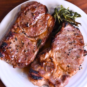 Coppa pork steak on white plate.